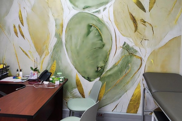 Professional installation of durable commercial vinyl wallpaper and branded wallcoverings in a modern office environment.